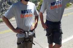 2 men wearing climbing gear