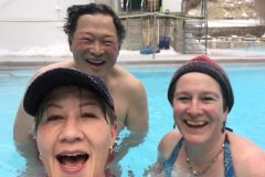 2 people smiling in a hot tub